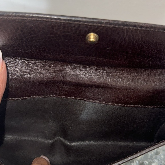 Gucci Chocolate Brown Long Wallet has its crossbody chain attached. - Picture 4 of 10